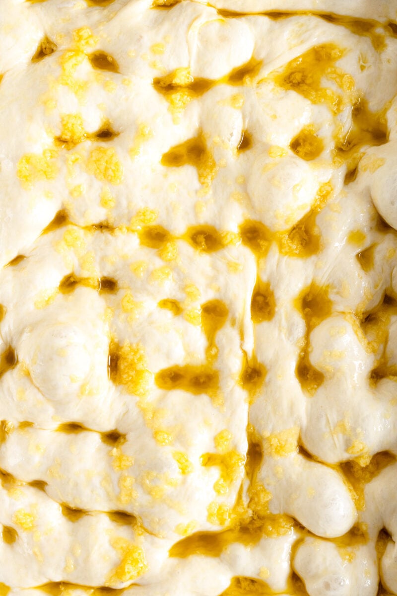 close up image of dimpled focaccia dough