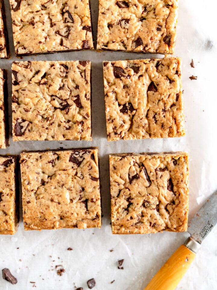 chocolate chip cookie bars on wax paper.