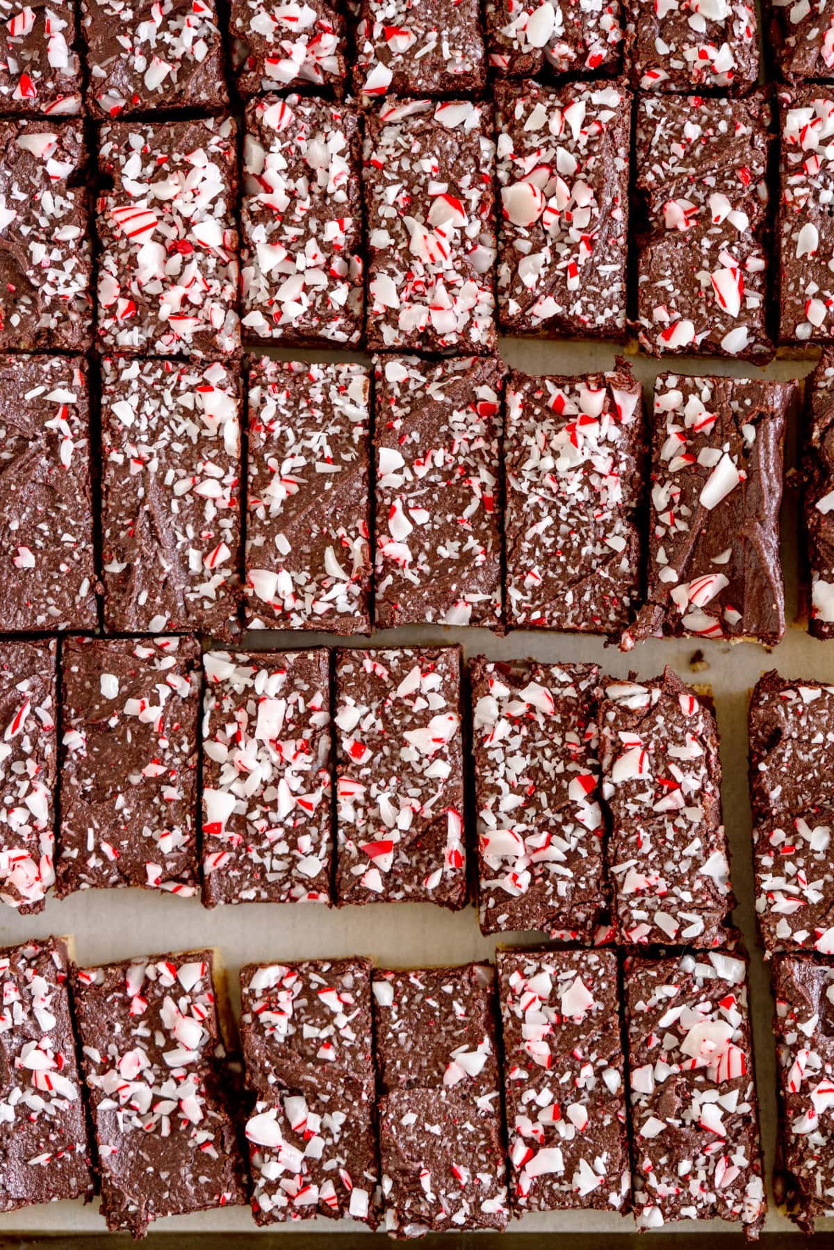 cookie bars with chocolate frosting and candy canes