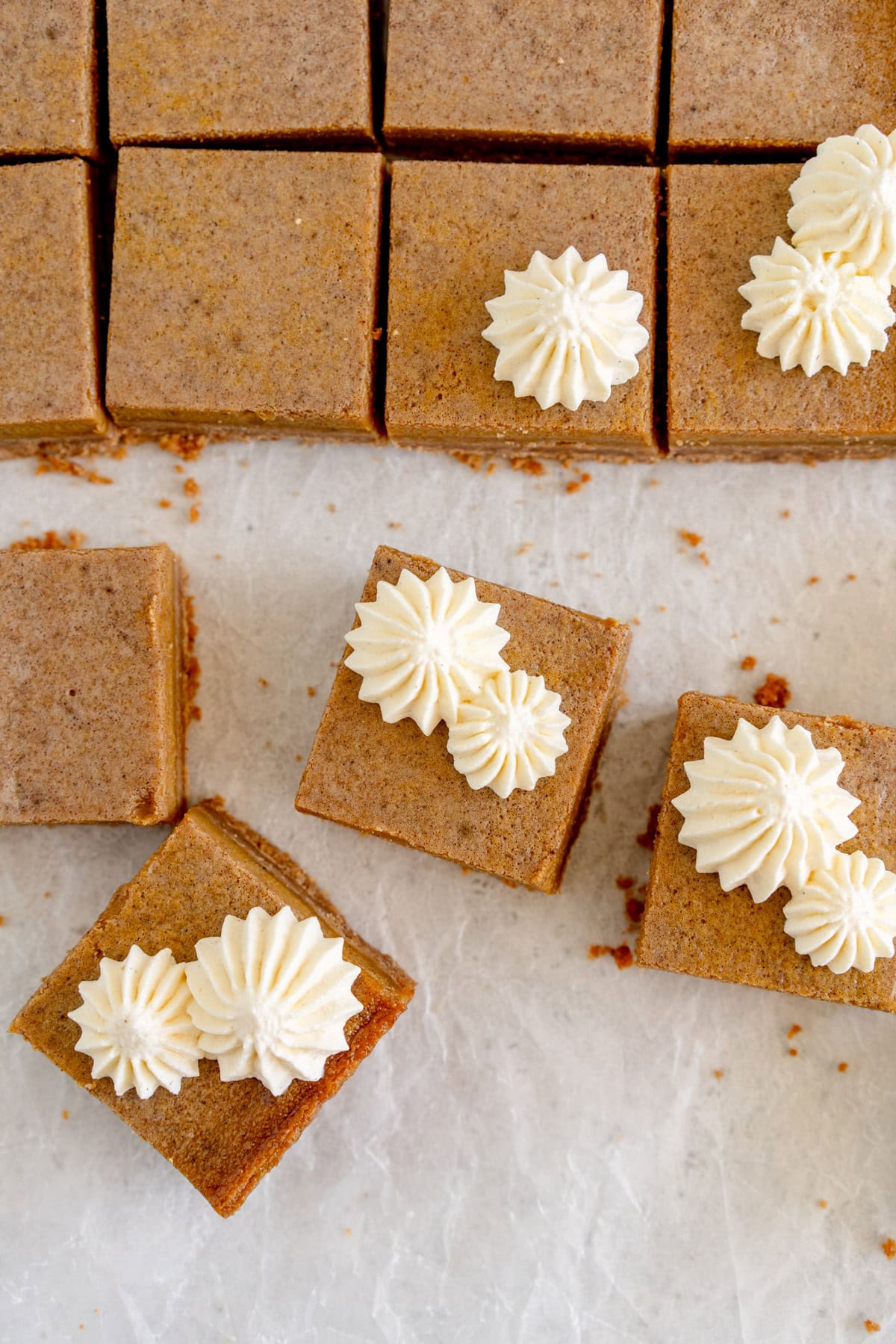 piped whipped cream on pumpkin bars
