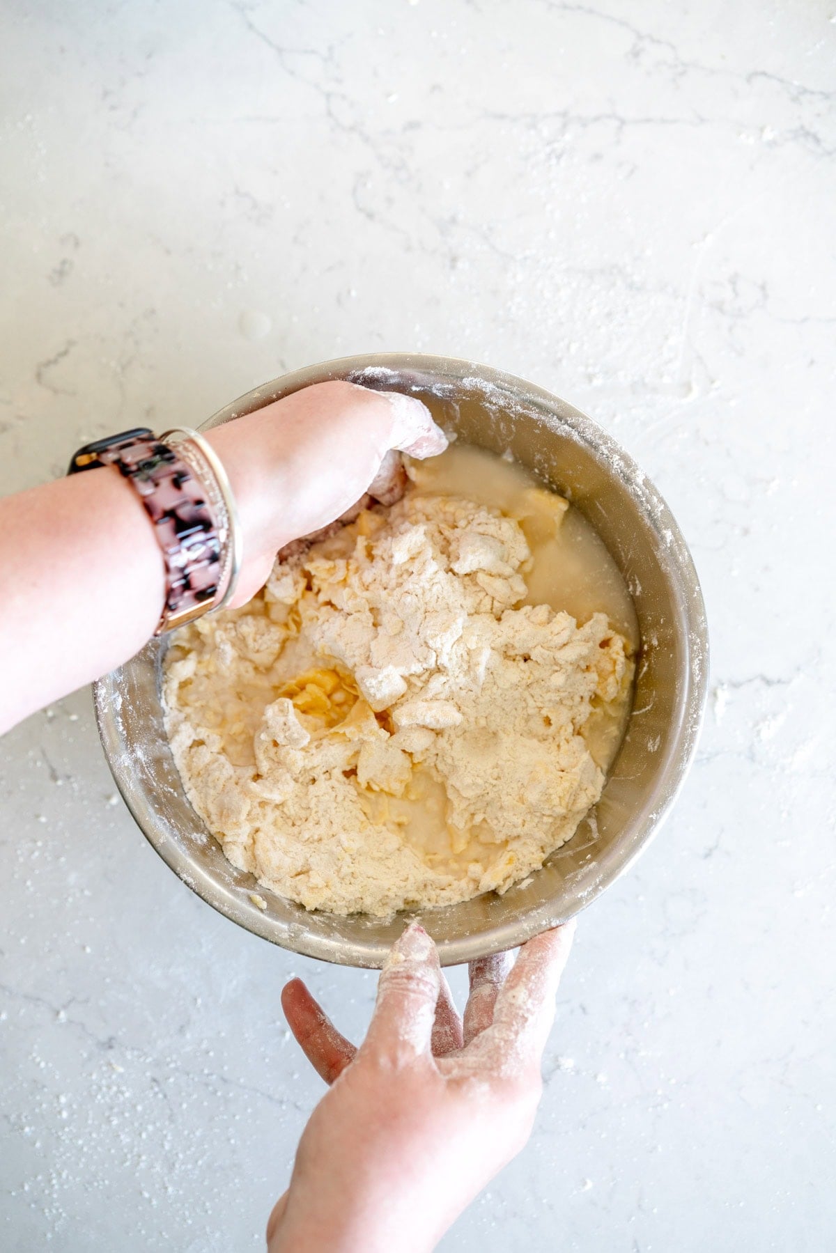 mixing in water to pie crust