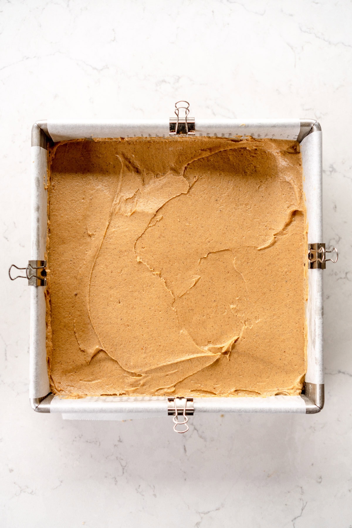 cake spread into pan