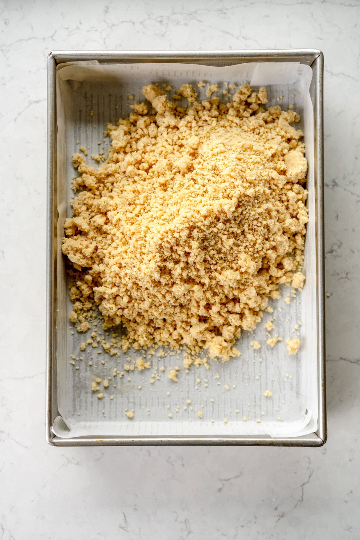 Transfer into pan and then flatten