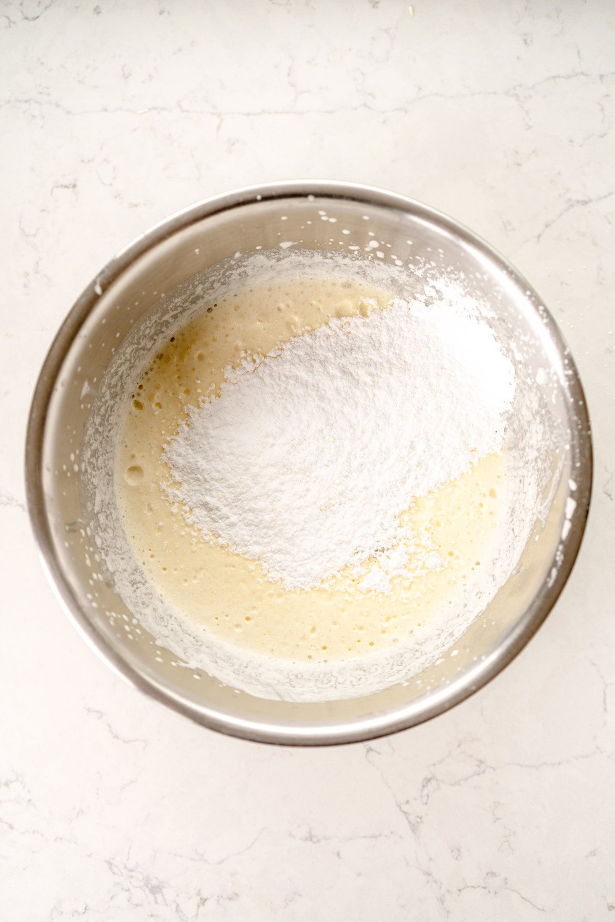 confectioner's sugar on cream