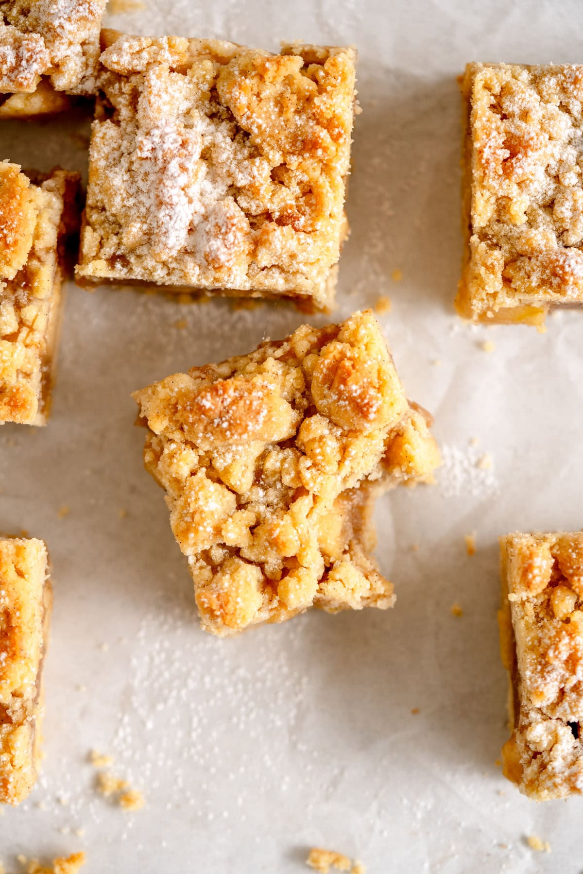 piece of apple pie bar topped with crumble