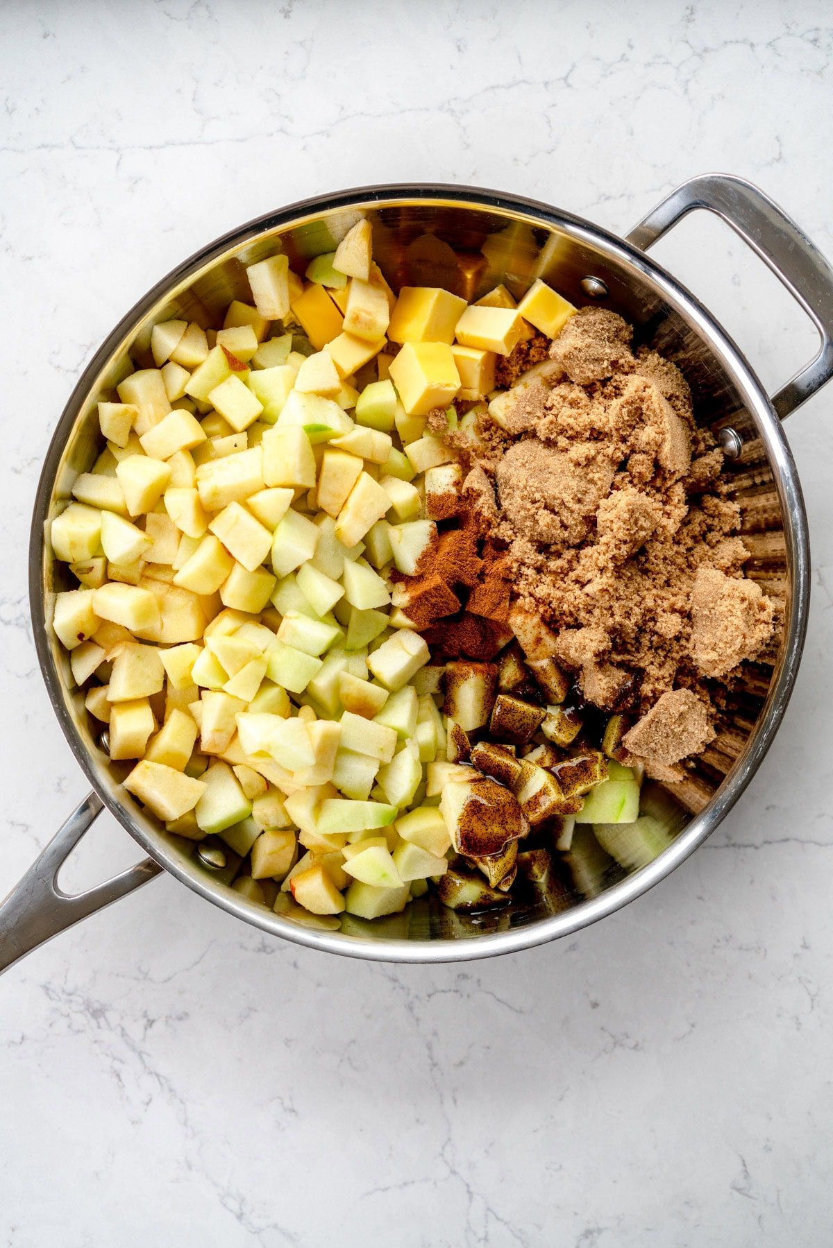 apples and filling ingredients in frying pan