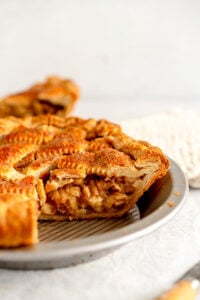 side on shot of apple pie in pan