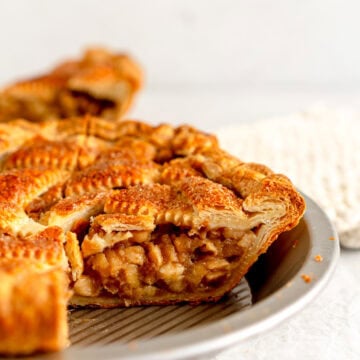 side on shot of apple pie in pan