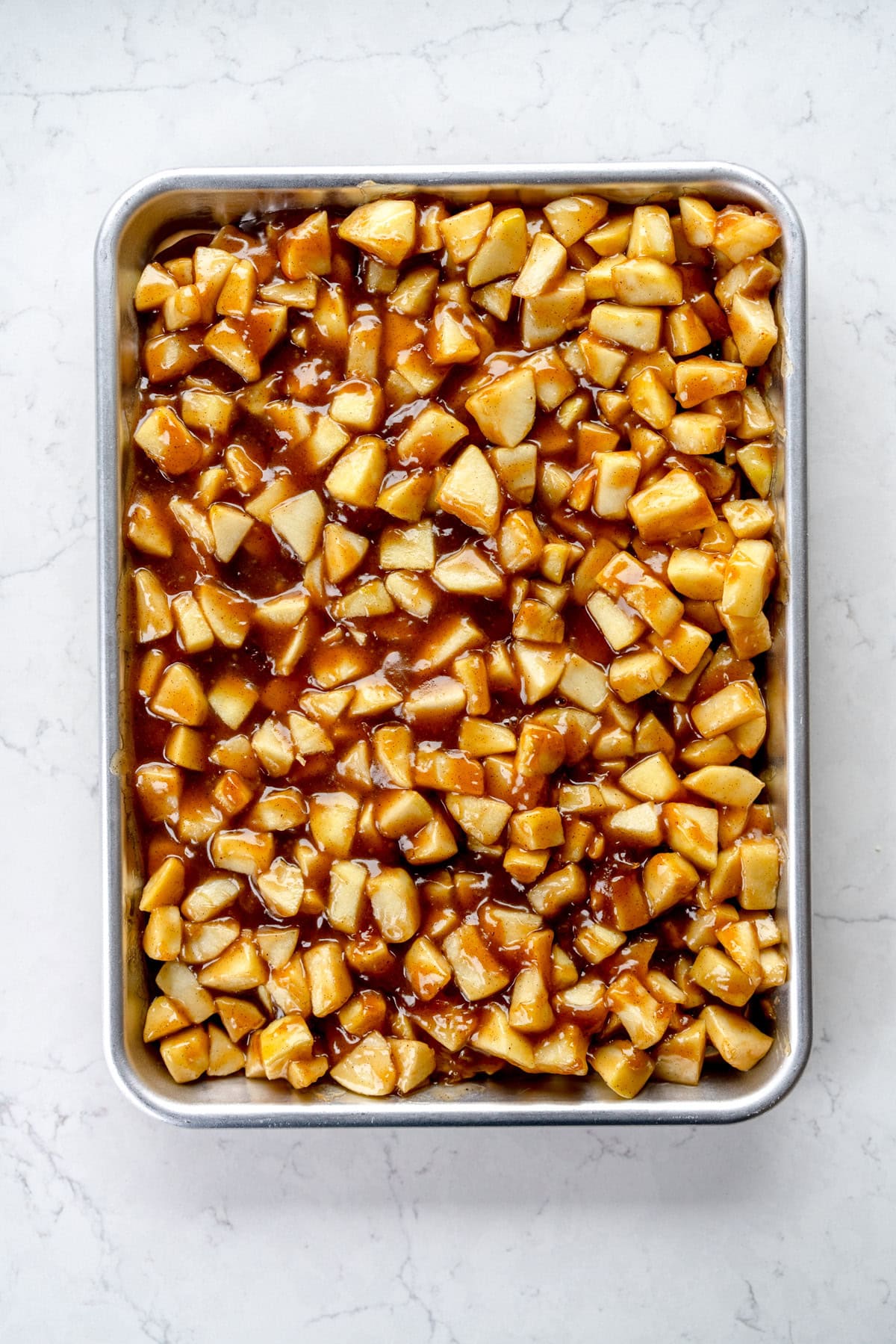 apple pie filling cooling on a sheet pan
