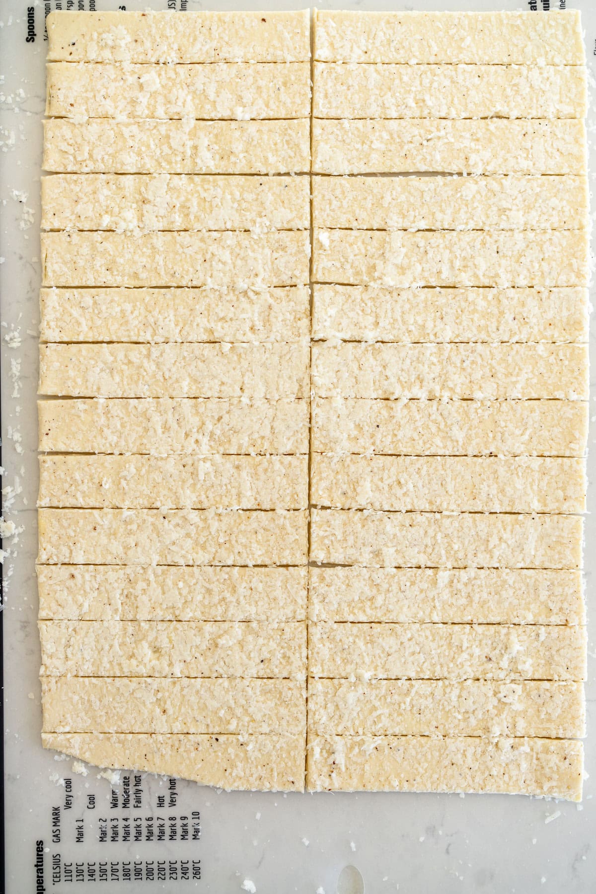 rolled out dough cut into strips