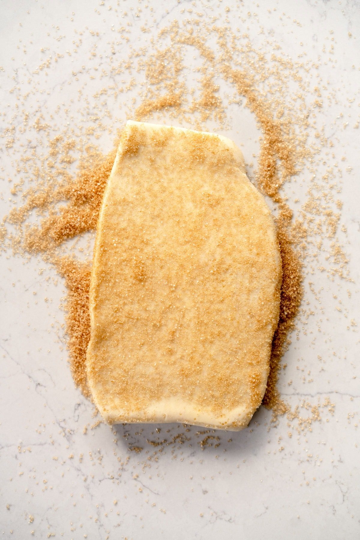dough rolled out on sugar