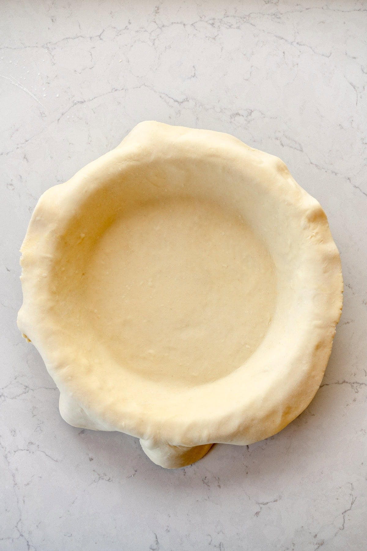 pie pan lined with crust