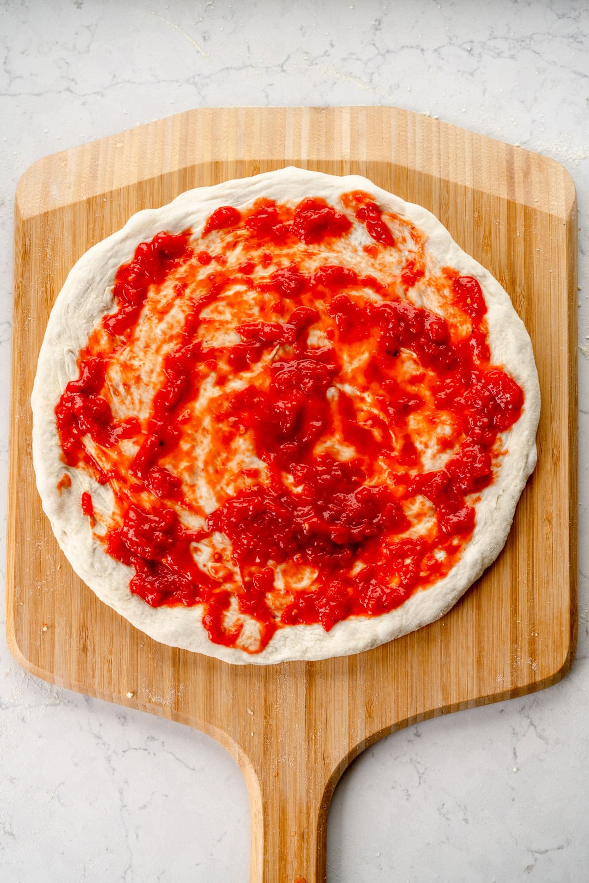 sauced pizza base