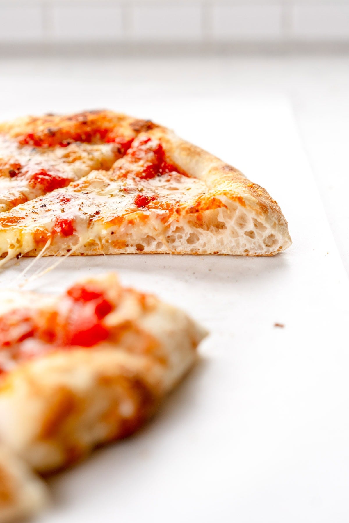 side on shot of baked pizza