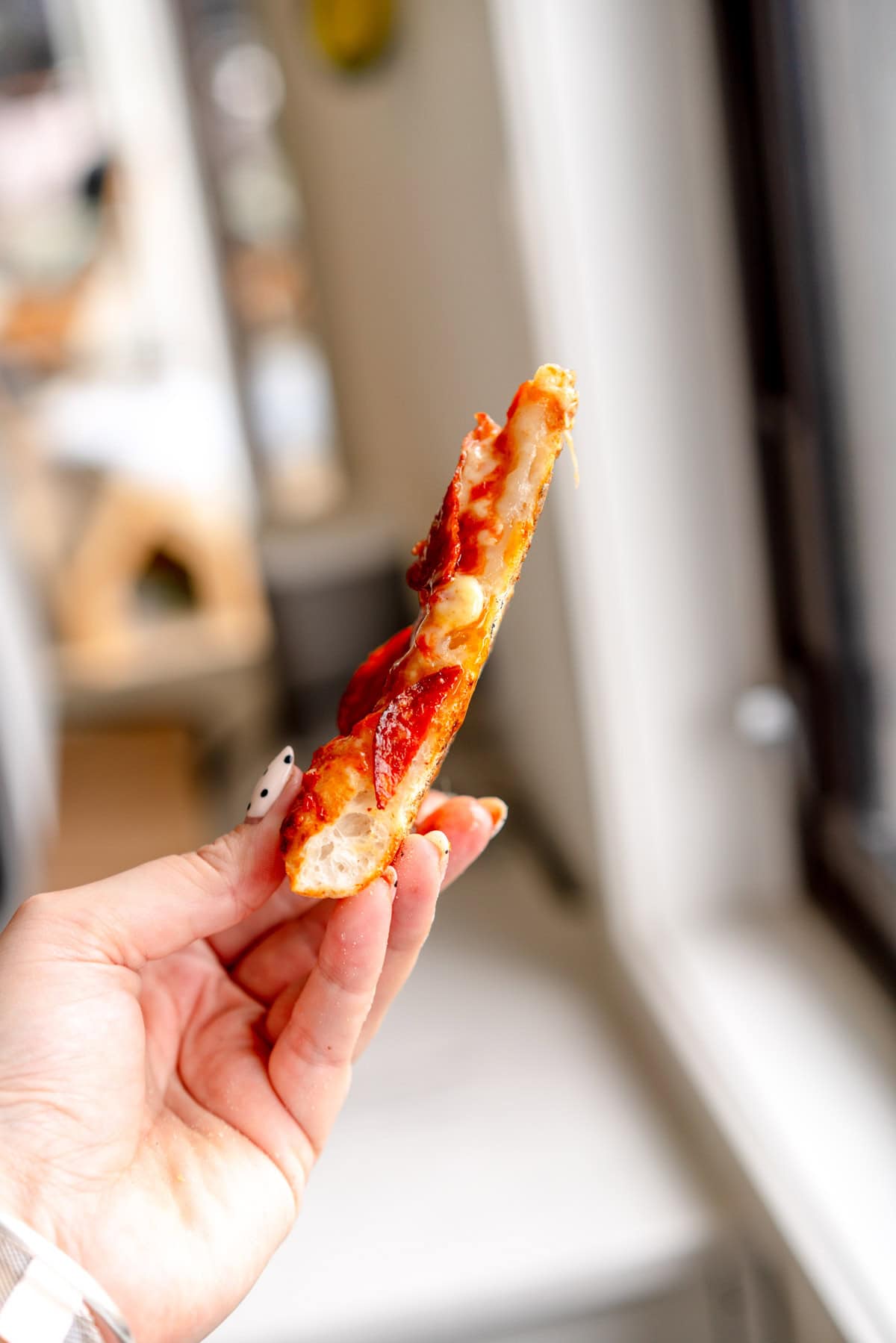 side on piece of pepperoni pizza