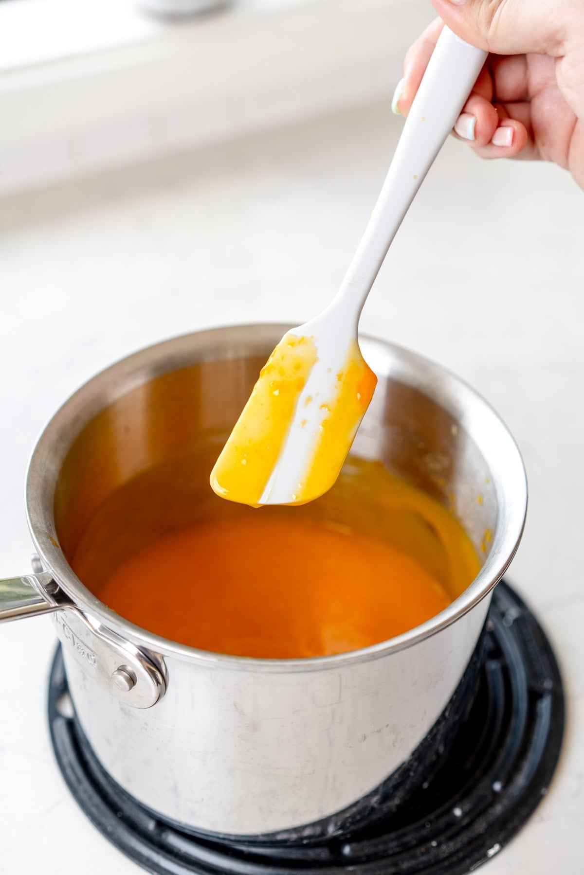 spatula with lemon curd on it