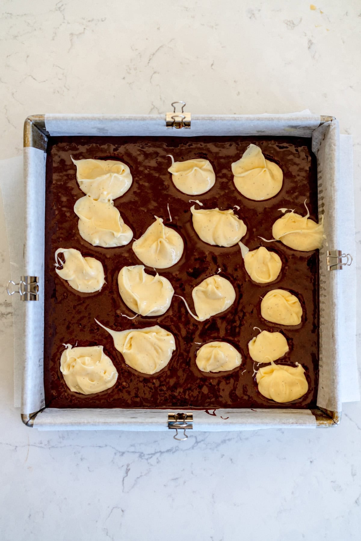 add blobs of cheesecake topping
